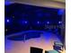 Inviting pool area with blue lighting at night at 15808 42Nd E Gln, Parrish, FL 34219
