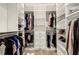 Large walk-in closet with custom shelving and rods at 15808 42Nd E Gln, Parrish, FL 34219