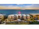 Aerial view of waterfront building, showcasing its location and design at 1600 W Marion Ave # 213, Punta Gorda, FL 33950