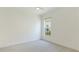 Simple bedroom with large window and ceiling fan at 16511 Cornwall Ln, Bradenton, FL 34202