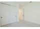 Bright bedroom with double door closet and hallway view at 16511 Cornwall Ln, Bradenton, FL 34202