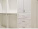 Spacious walk-in closet with built-in shelves and drawers at 16511 Cornwall Ln, Bradenton, FL 34202
