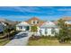 White two-story house with gray roof and paved driveway at 16511 Cornwall Ln, Bradenton, FL 34202