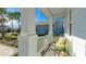 Relaxing front porch with seating and tropical plants at 16511 Cornwall Ln, Bradenton, FL 34202