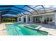 Inviting screened pool and spa with spacious patio at 16511 Cornwall Ln, Bradenton, FL 34202