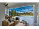 Relaxing screened-in patio with pool and spa, wicker furniture, and outdoor dining area at 16511 Cornwall Ln, Bradenton, FL 34202