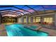 Expansive pool and covered patio with seating and dining areas at 16511 Cornwall Ln, Bradenton, FL 34202
