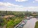 Aerial view of community with lush landscaping and private boat docks at 1704 Pelican Cove Rd # T138, Sarasota, FL 34231
