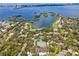 Aerial view showing community amenities including tennis courts and pools at 1704 Pelican Cove Rd # T138, Sarasota, FL 34231