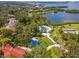 Aerial view of community with pool, landscaping, and waterfront access at 1704 Pelican Cove Rd # T138, Sarasota, FL 34231