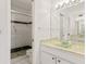 Bathroom with shower, toilet, and vanity with green countertop at 1704 Pelican Cove Rd # T138, Sarasota, FL 34231