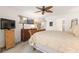 Main bedroom with a wooden sleigh bed, dresser, and TV at 1704 Pelican Cove Rd # T138, Sarasota, FL 34231