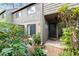 Condo exterior with private entrance and lush landscaping at 1704 Pelican Cove Rd # T138, Sarasota, FL 34231