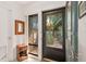 Bright and airy front entryway with a view to a garden at 1704 Pelican Cove Rd # T138, Sarasota, FL 34231