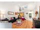 Open living area showcasing hardwood floors and comfy seating at 1704 Pelican Cove Rd # T138, Sarasota, FL 34231