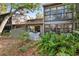 Relaxing patio area with seating and lush landscaping at 1704 Pelican Cove Rd # T138, Sarasota, FL 34231