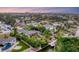 Aerial view of waterfront home with private dock and lush landscaping at 1739 Shelburne Ln, Sarasota, FL 34231