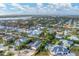 Aerial view of luxury waterfront homes in a tropical setting at 1739 Shelburne Ln, Sarasota, FL 34231