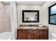 Clean bathroom with granite countertop and tiled shower at 1739 Shelburne Ln, Sarasota, FL 34231