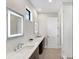 Modern bathroom with double vanity, marble counters, and a large shower at 1739 Shelburne Ln, Sarasota, FL 34231