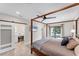 Main bedroom with a king-size bed, sliding barn door, and en-suite bathroom at 1739 Shelburne Ln, Sarasota, FL 34231