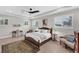 Main bedroom with king bed, wood floors, and lots of natural light at 1739 Shelburne Ln, Sarasota, FL 34231