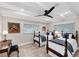 Charming bedroom with twin beds, a desk, and large windows at 1739 Shelburne Ln, Sarasota, FL 34231
