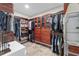 Large walk-in closet with custom built-ins and ample storage at 1739 Shelburne Ln, Sarasota, FL 34231