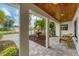Relaxing covered patio with seating, overlooking a landscaped courtyard at 1739 Shelburne Ln, Sarasota, FL 34231