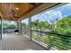 Screened-in balcony overlooking a tropical landscape at 1739 Shelburne Ln, Sarasota, FL 34231