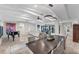 Open concept dining room with large table and modern chandelier at 1739 Shelburne Ln, Sarasota, FL 34231