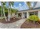 Elegant entryway with a fountain and walkway leading to the front door at 1739 Shelburne Ln, Sarasota, FL 34231