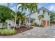 Luxury home with palm trees, fountain, and a paved driveway at 1739 Shelburne Ln, Sarasota, FL 34231