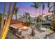 Waterfront fire pit with seating, offering tranquil views at 1739 Shelburne Ln, Sarasota, FL 34231