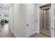 Elegant hallway with elevator and access to other rooms at 1739 Shelburne Ln, Sarasota, FL 34231