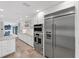 Modern kitchen with stainless steel appliances and white cabinetry at 1739 Shelburne Ln, Sarasota, FL 34231