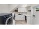 Bright laundry room with white cabinets and built-in sink at 1739 Shelburne Ln, Sarasota, FL 34231