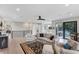 Bright living room with hardwood floors, comfy seating, and access to a deck at 1739 Shelburne Ln, Sarasota, FL 34231