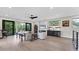 Open living space with fireplace, wet bar, and balcony access at 1739 Shelburne Ln, Sarasota, FL 34231