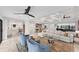Open living space featuring a light sectional sofa and two armchairs at 1739 Shelburne Ln, Sarasota, FL 34231