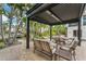 Outdoor patio with seating area under pergola, perfect for entertaining at 1739 Shelburne Ln, Sarasota, FL 34231