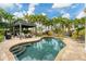 Inviting freeform pool with large patio and pergola at 1739 Shelburne Ln, Sarasota, FL 34231