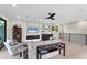 Cozy recreation room with fireplace and built-in shelving at 1739 Shelburne Ln, Sarasota, FL 34231