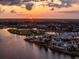 Aerial view of upscale community at sunset, featuring a waterfront, park, and town center at 1743 Pinyon Pine Dr, Sarasota, FL 34240