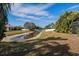 Peaceful backyard with canal view and lush landscaping at 1743 Pinyon Pine Dr, Sarasota, FL 34240
