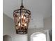 Ornate chandelier with a dark metal finish at 1743 Pinyon Pine Dr, Sarasota, FL 34240