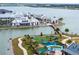 Aerial view of a waterfront community with shops, playground, and walking paths at 1743 Pinyon Pine Dr, Sarasota, FL 34240
