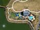 Aerial view of a park with playground, walking paths and a community building at 1743 Pinyon Pine Dr, Sarasota, FL 34240