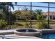 Tranquil water feature near the screened pool at 1743 Pinyon Pine Dr, Sarasota, FL 34240