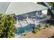 Aerial view of a home with a screened pool and patio area at 1743 Pinyon Pine Dr, Sarasota, FL 34240